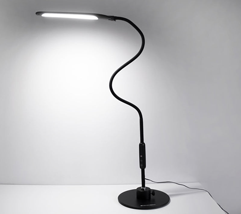 The Magno Lumina Max Desk Lamp shown with it's light on, is ideal for those with low vision because it allows users to select the optimal light color temperature and brightness level settings to maximize their viewing environment. This corded lamp is available in a desktop and floor version and provides superior illumination. It's black flexible neck and weighted base makes it ideal for users with low vision.