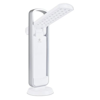 Task lamp in all white with silver handle above. LED lights are visible  on the open arm with the Ottlite logo visible. in the center